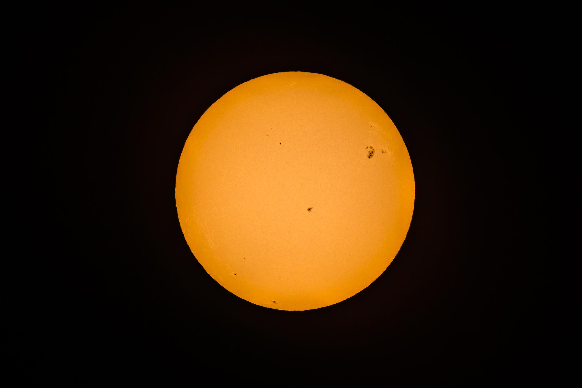 The sun photographed over the University of Rochester River Campus